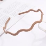 serre tete vague homme beige